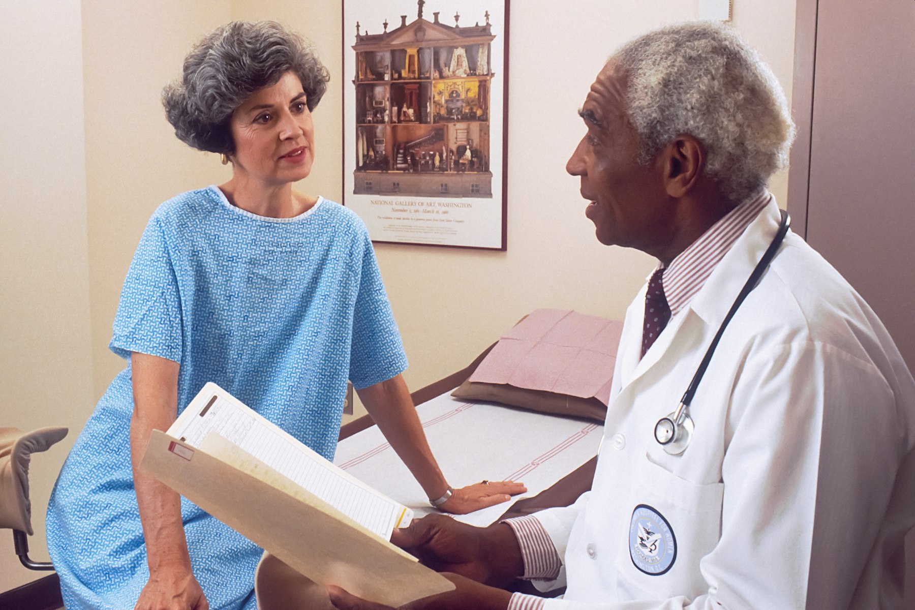 Cardiologist discussing long-term heart rhythm monitoring with a patient