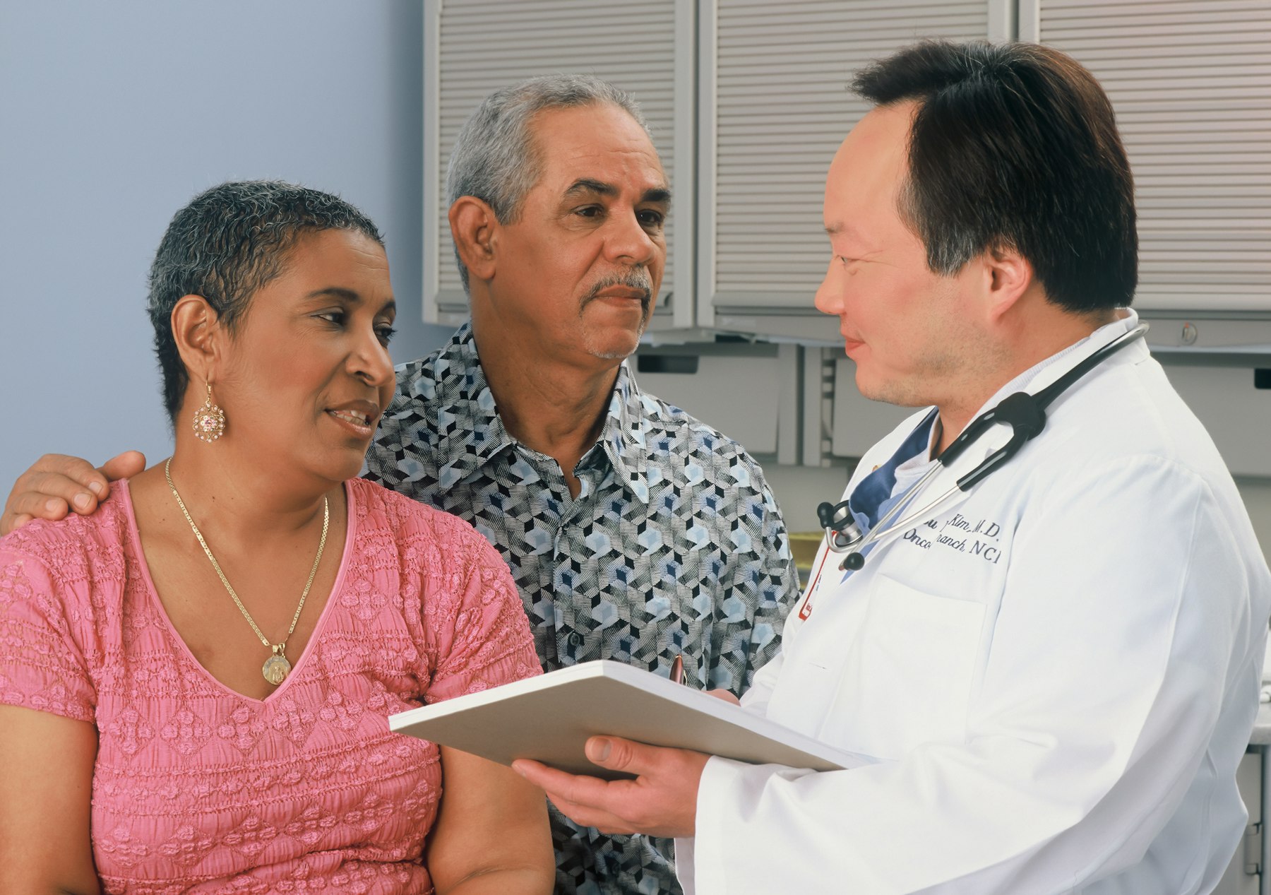 Doctor talking with an older couple about vascular symptoms