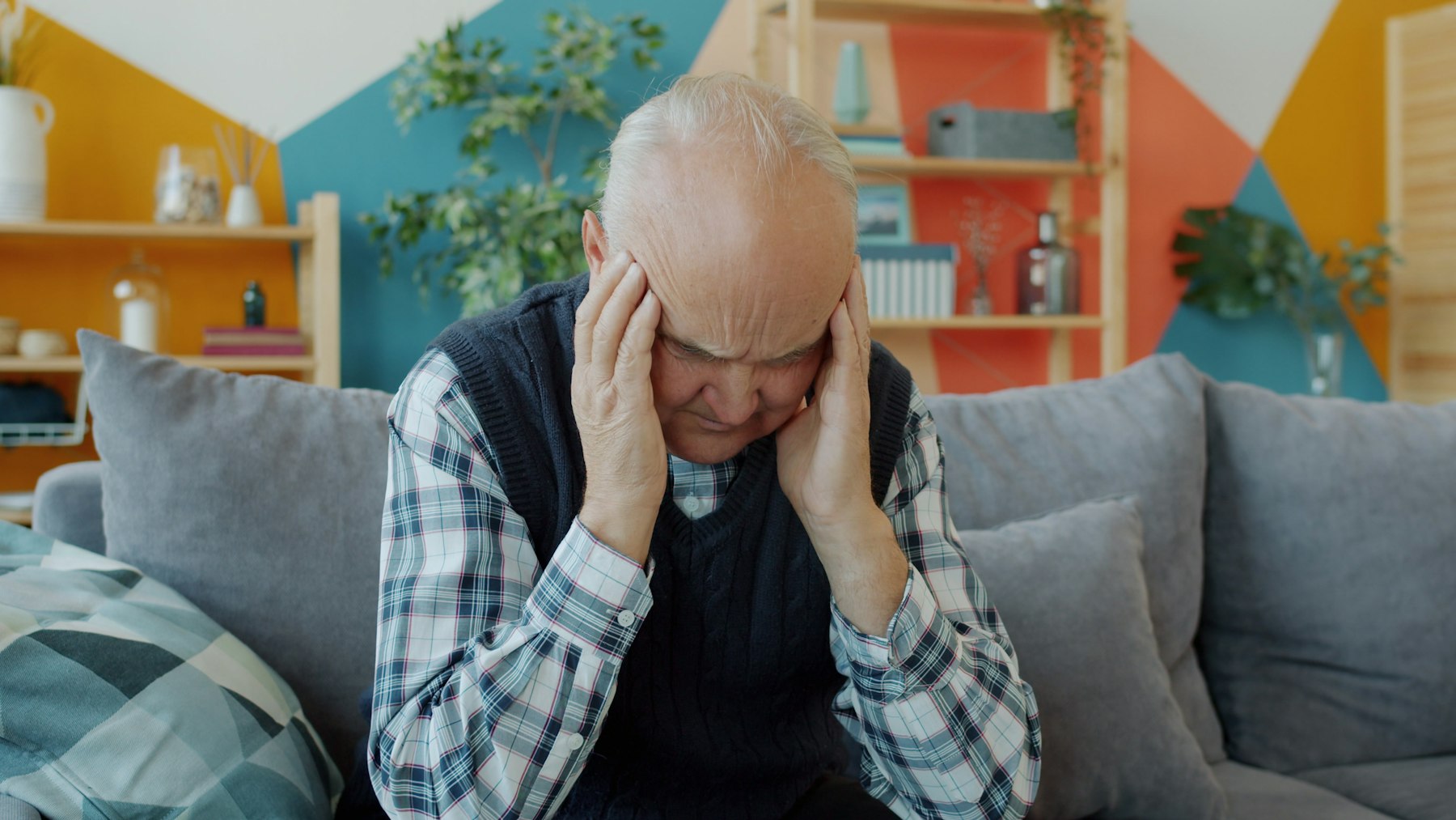 Older man feeling dizzy, a symptom that may need a loop recorder